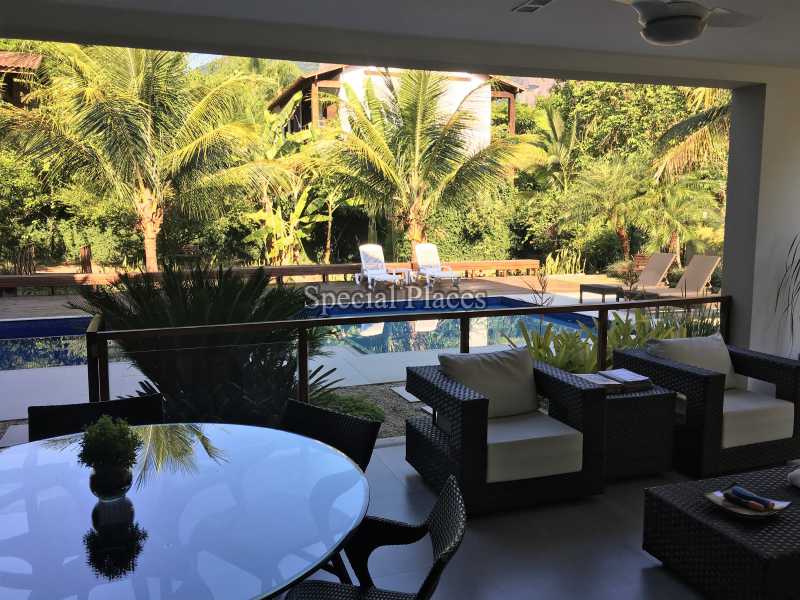 Conheça Varandão integrado ao estar do imóvel - Casa À Venda no Condomínio Itanhangá, Reserva - Barra da Tijuca - Rio de Janeiro - RJ - BAC6062 - 9 Varandão integrado ao estar